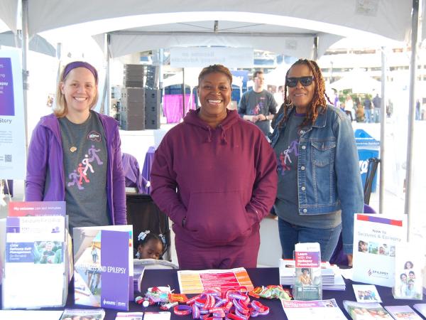 Epilepsy Foundation employees at a tent with program information